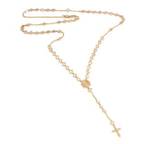 Gold rosary necklace on a white background