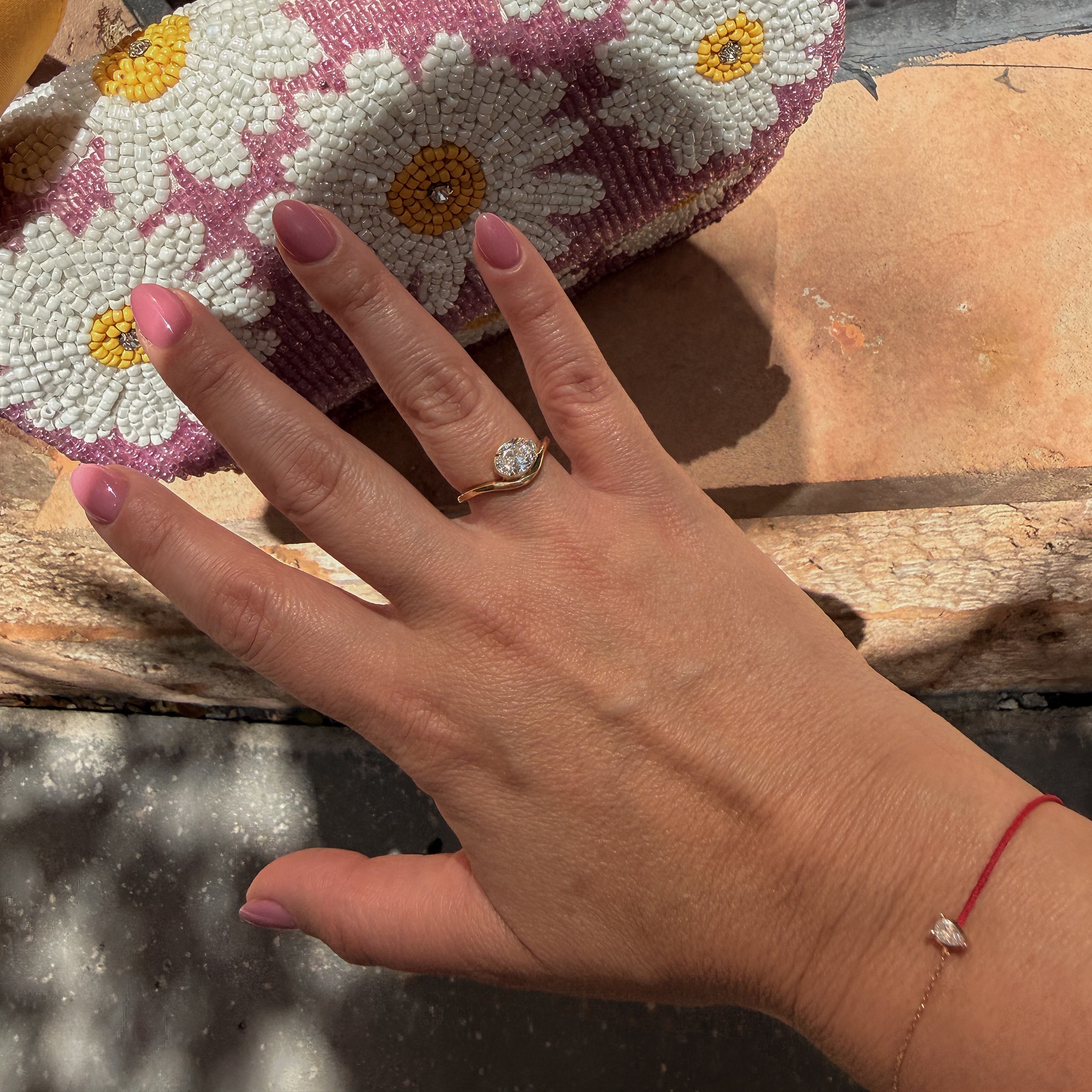  modern yellow gold diamond ring with bezel setting and curved bypass band 1ct