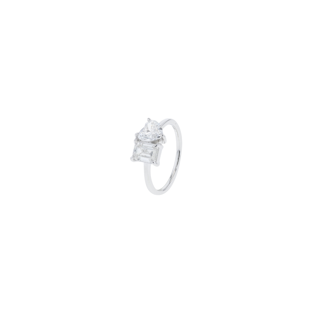 Diamond ring with a baguette cut diamond on a white background