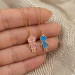 14K gold enamel boy and girl charm pendants displayed on delicate gold chains representing personalized family jewelry