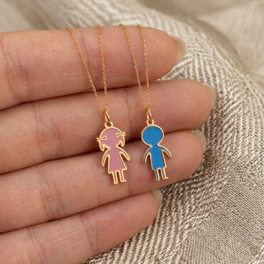 14K gold enamel boy and girl charm pendants displayed on delicate gold chains representing personalized family jewelry