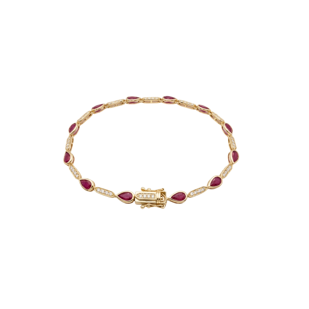 Gold bracelet with red gemstones on a white background