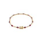 Gold bracelet with red gemstones on a white background