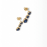 18K yellow gold natural blue sapphire dangle earrings with three sapphire stones in a graduated drop design.