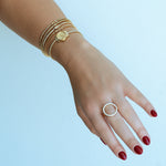 delicate diamond bracelet near watch on model hand