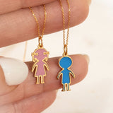 14K solid yellow gold personalized enamel boy and girl charm pendants shown in pink and blue enamel on a white background
