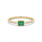     Delicate 14K yellow gold emerald cut green CZ ring with diamond accents held between fingers