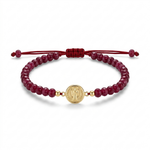 14K solid yellow gold Saint Benedict bracelet front view with Indian ruby stones, red satin adjustable macramé cord, and front-facing Saint Benedict medal