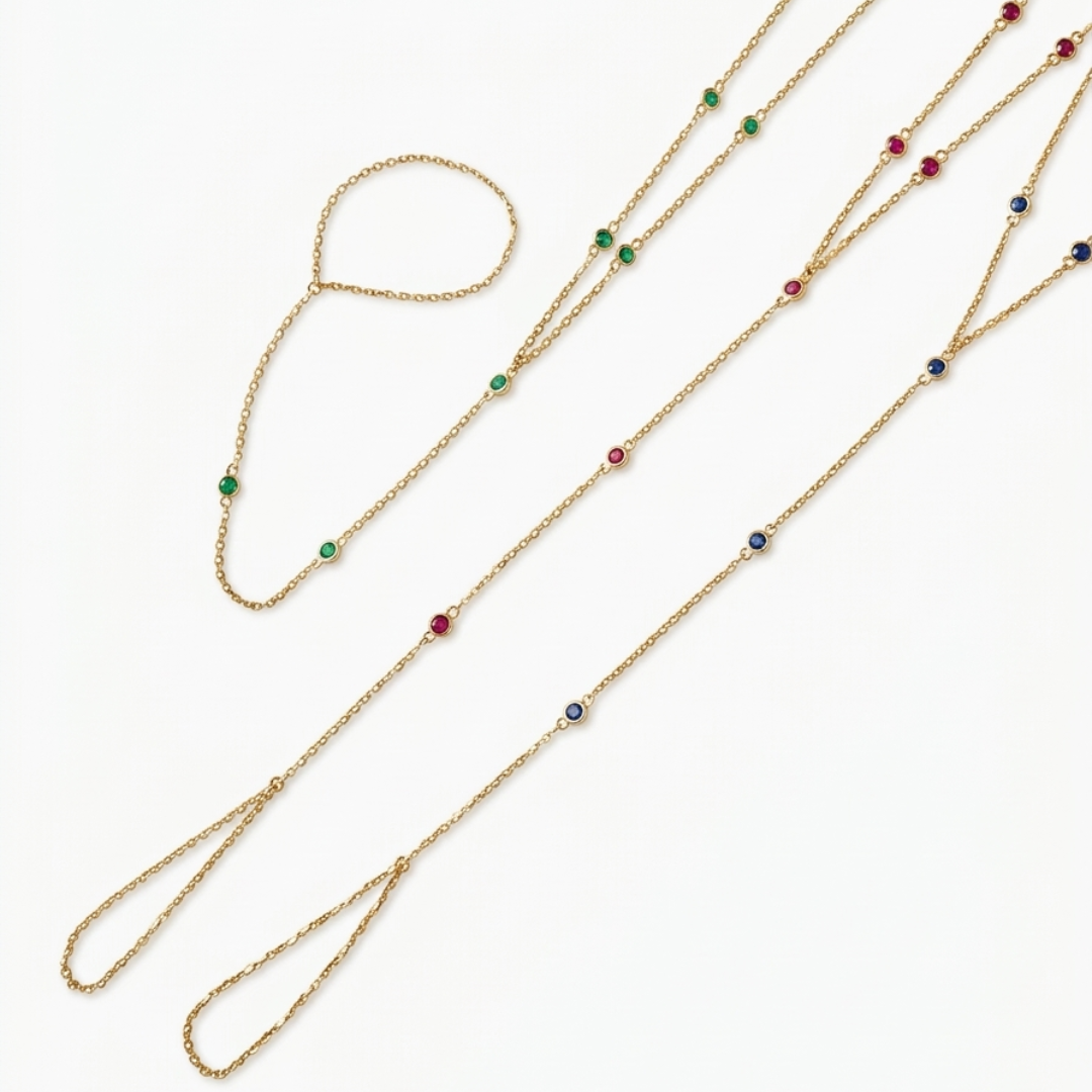 14k gold gemstone hand chain bracelets with emerald ruby and blue sapphire variants on white background
