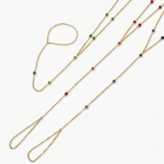 14k gold gemstone hand chain bracelets with emerald ruby and blue sapphire variants on white background