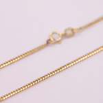 14K Solid Gold Cuban Chain 1.5mm in a white background.