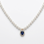 18K solid yellow gold pearl necklace with 118 cultured pearls, an oval blue sapphire centerpiece, and a diamond halo pendant.