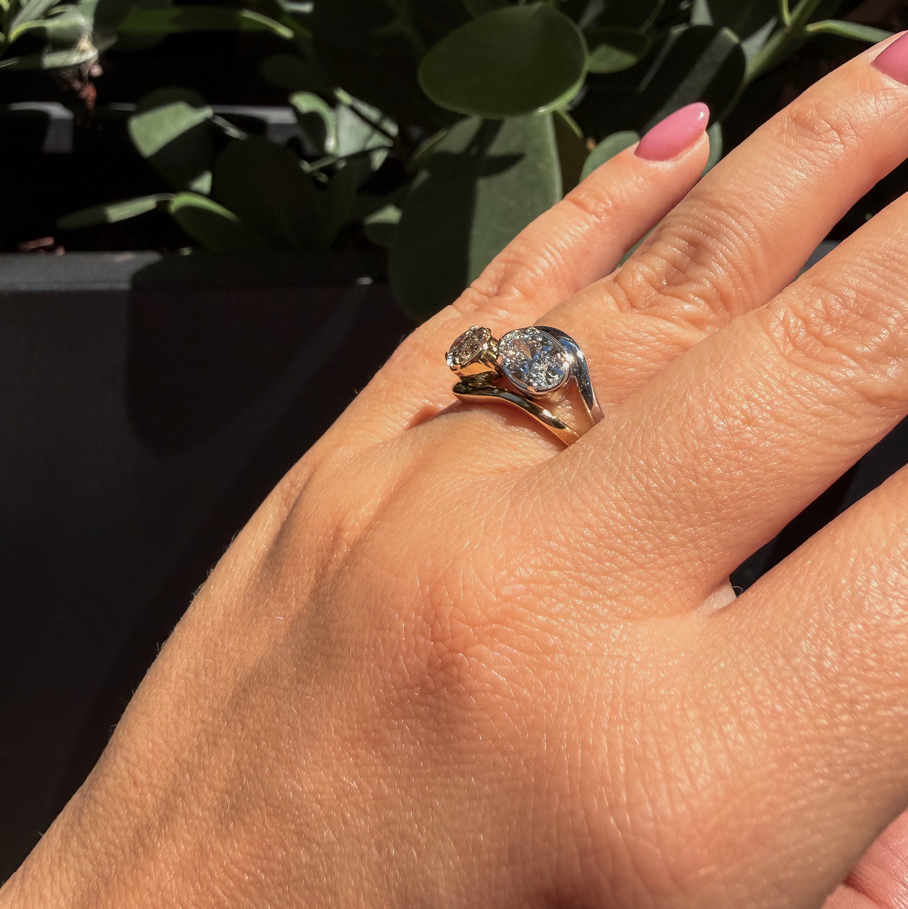 Laraquel white gold diamond ring worn on hand natural sunlight luxury jewelry