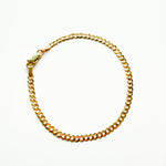 Gold chain bracelet on a white background