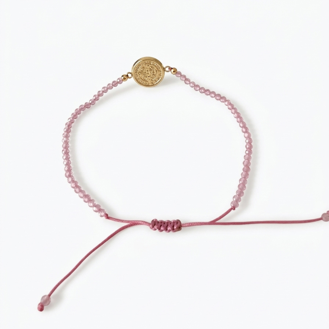 14k yellow gold saint benedict bracelet with pink crystal beads and adjustable pink macrame cord

