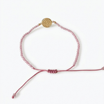 14k yellow gold saint benedict bracelet with pink crystal beads and adjustable pink macrame cord

