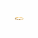Gold ring with small stones on a white background