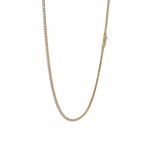 Gold chain necklace on a white background