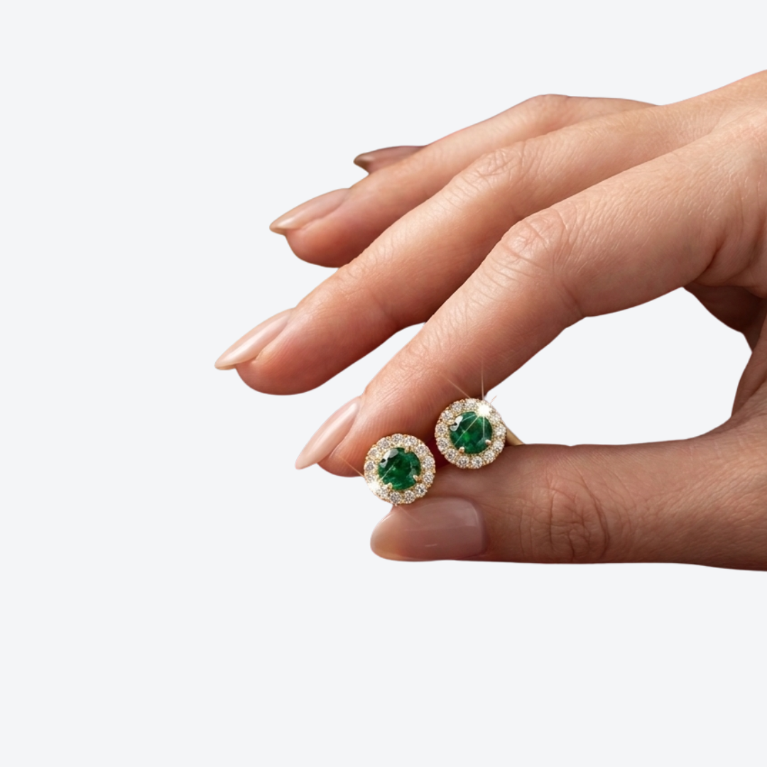 14K solid yellow gold round green emerald CZ halo stud earrings with sparkling clear CZ accents on white background.