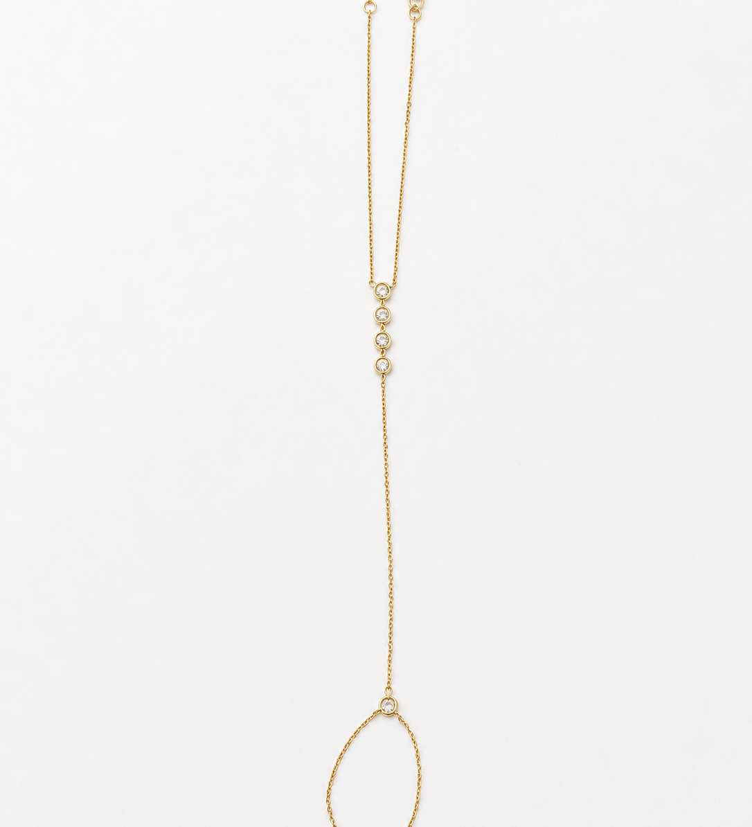 14K solid yellow gold hand chain bracelet laid flat, showing the finger ring, connecting chain, five bezel diamonds, and adjustable wrist bracelet.