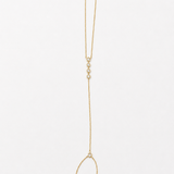14K solid yellow gold hand chain bracelet laid flat, showing the finger ring, connecting chain, five bezel diamonds, and adjustable wrist bracelet.