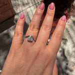 minimalist white gold diamond ring with bezel setting and curved band