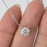 front close-up of 1 ct round brilliant certified lab-grown diamond necklace in 14K white gold on fingers