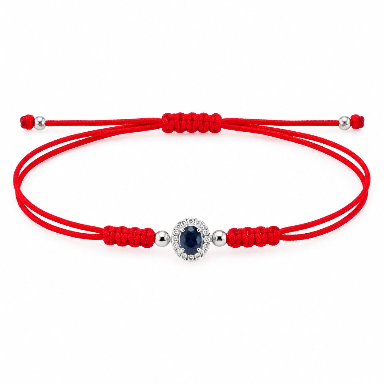 14K solid white gold red silk cord bracelet featuring a natural oval blue sapphire surrounded by pavé diamonds, four polished white gold beads and an adjustable sliding knot closure.