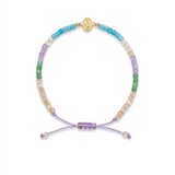 14K solid yellow gold Virgen Milagrosa multicolor 3 mm square shape quartz light purple macramé bracelet styled in a luxury layered wrist stack.