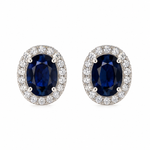 Pair of solid 14K white gold oval natural blue sapphire stud earrings surrounded by sparkling natural pavé diamond halos, front view.