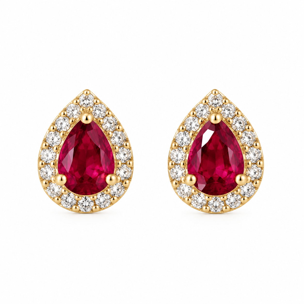 Pair of natural pear-shaped ruby stud earrings surrounded by pavé diamond halos in polished 14K solid yellow gold with push-back closures.