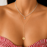 Solid 14K yellow gold paperclip lariat necklace worn layered.