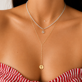 Solid 14K yellow gold paperclip lariat necklace worn layered.