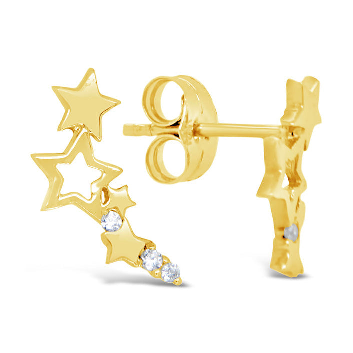 Gold star-shaped earrings with small diamonds on a white background