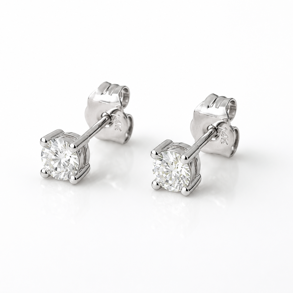 0.32 CT lab grown diamond stud earrings in solid 14K white gold with E color VS1 clarity and secure push back closures.