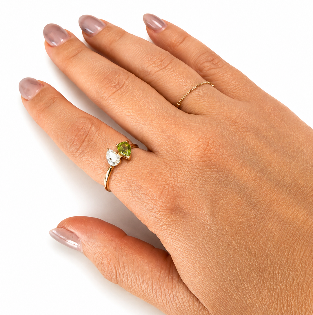 Custom pear-cut diamond and peridot birthstone ring handcrafted in 14K solid gold