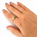 Custom pear-cut diamond and peridot birthstone ring handcrafted in 14K solid gold