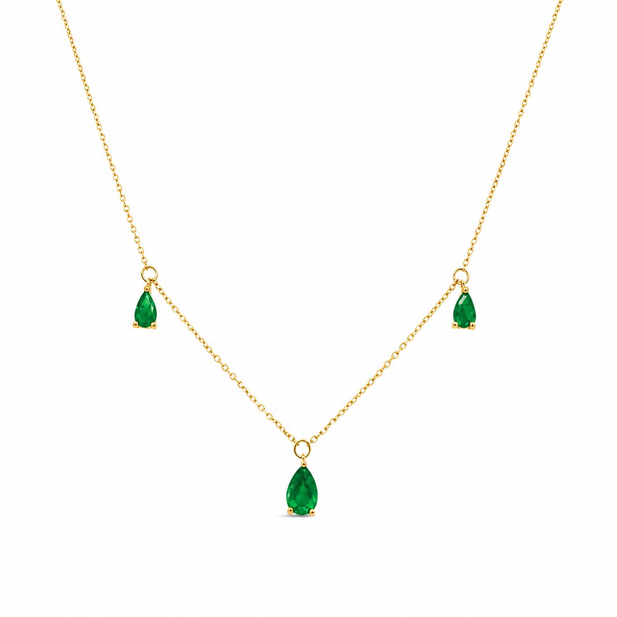 14K yellow gold necklace featuring three genuine pear-shaped emerald gemstones in delicate prong settings on a clean white background.