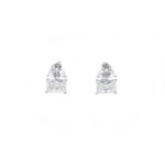 Pair of diamond stud earrings on a white background