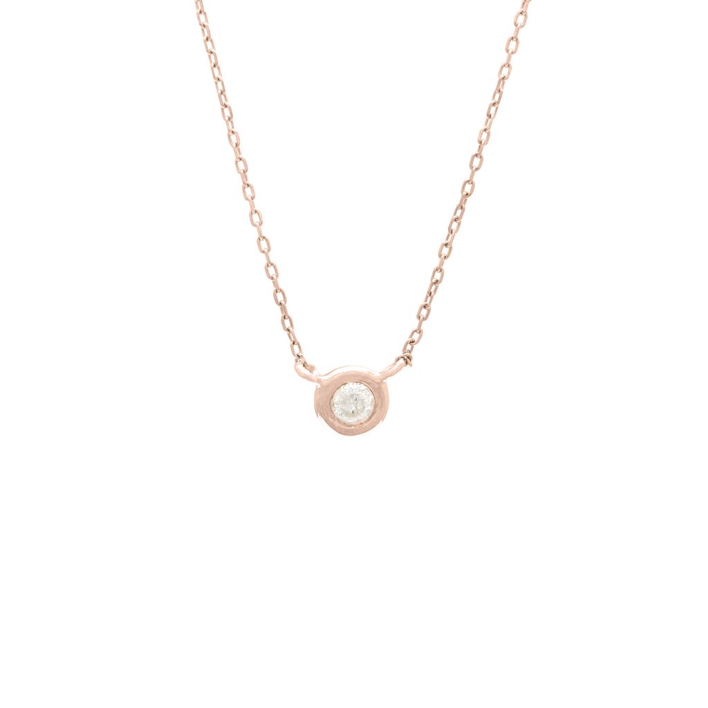 Rose gold necklace with a small round pendant on a white background