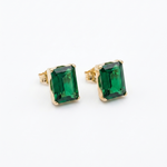 14K solid yellow gold emerald cut green CZ stud earrings with rectangular stones and butterfly backs.