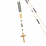 14K solid yellow gold unisex rosary necklace with faceted black cubic zirconia stones, Virgin Mary medal and gold cross on white background.