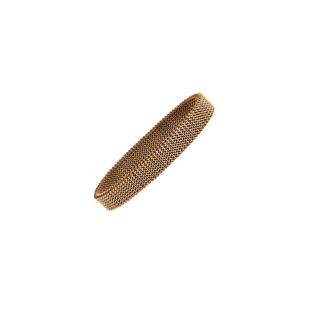 Gold mesh hair clip on a white background