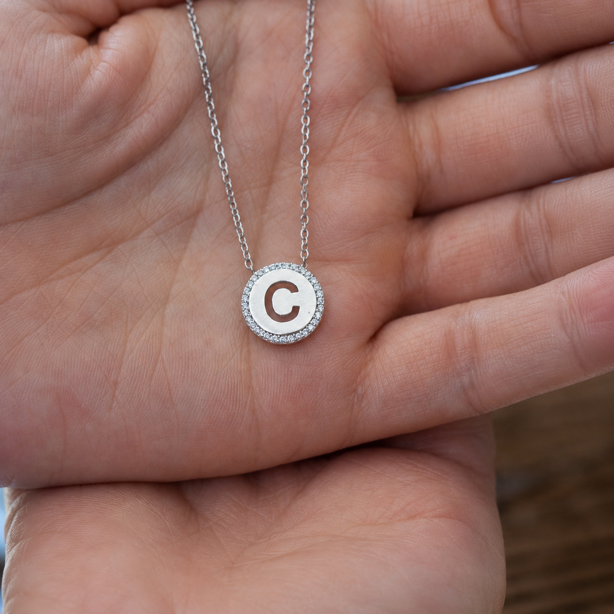 925 sterling silver cubic zirconia initial C necklace displayed on hand