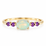 10K solid yellow gold ring with oval opal center stone and four round amethyst accents, size 7, on a white background.