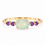 10K solid yellow gold ring with oval opal center stone and four round amethyst accents, size 7, on a white background.