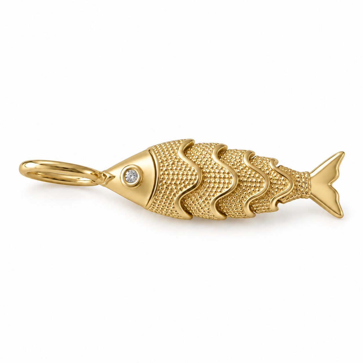 14K solid yellow gold flexible fish pendant with double-face textured design and two clear cubic zirconia eyes on a white background.