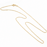 14K solid yellow gold delicate cable chain with spring ring clasp displayed on a white background.