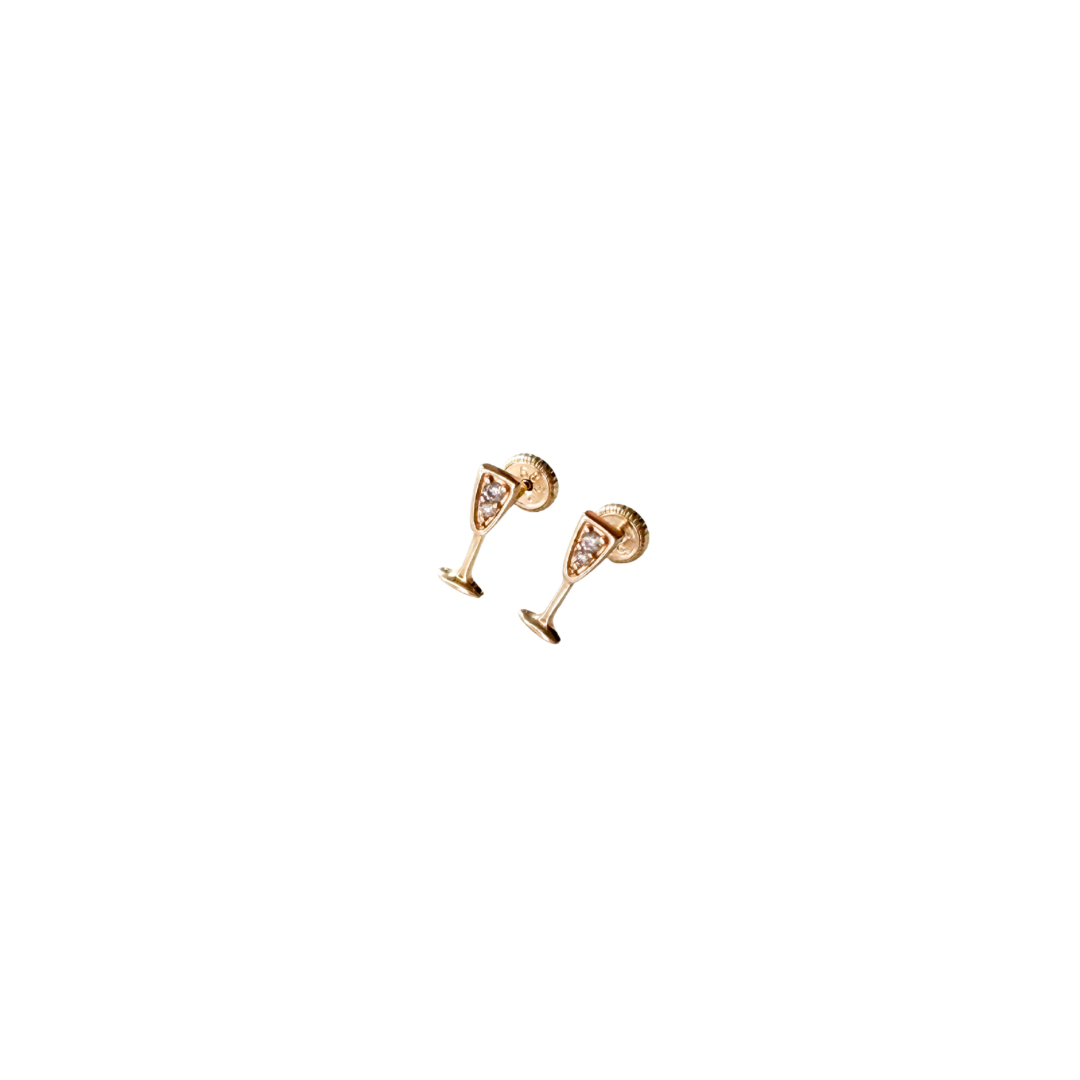 Gold champagne glass earrings on a white background