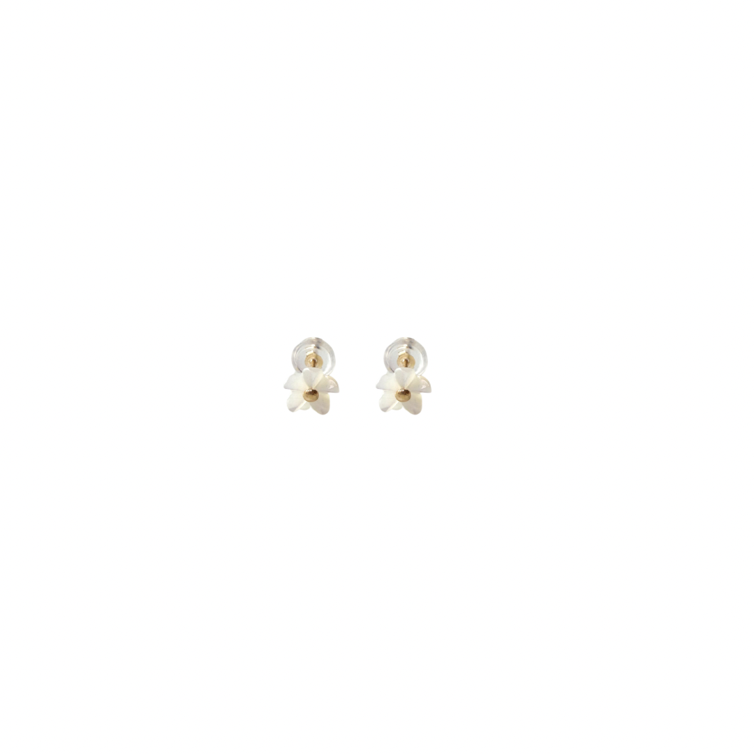 Pair of gold earrings on a white background